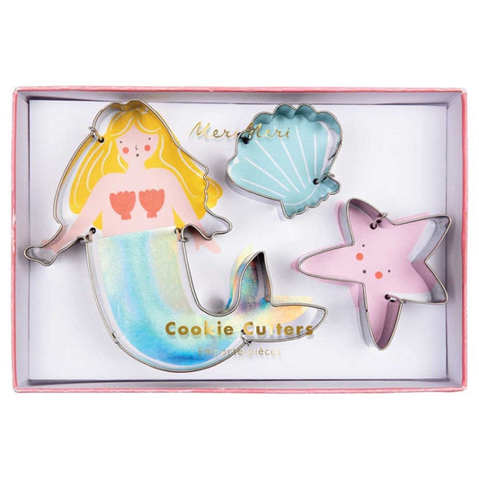 Set of cookie cutters shaped like a mermaid, shell, and starfish in a box.