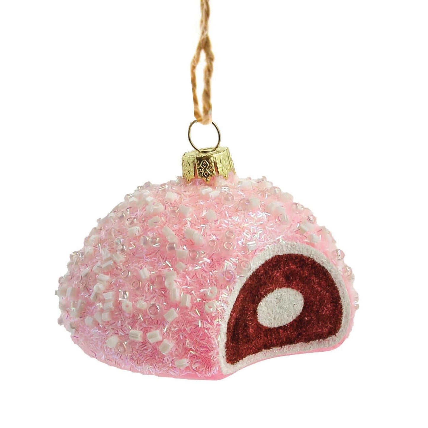 Pink textured snowball-shaped ornament with a small bite out of the side showing chocolate colored cake and white cream filling on a white background