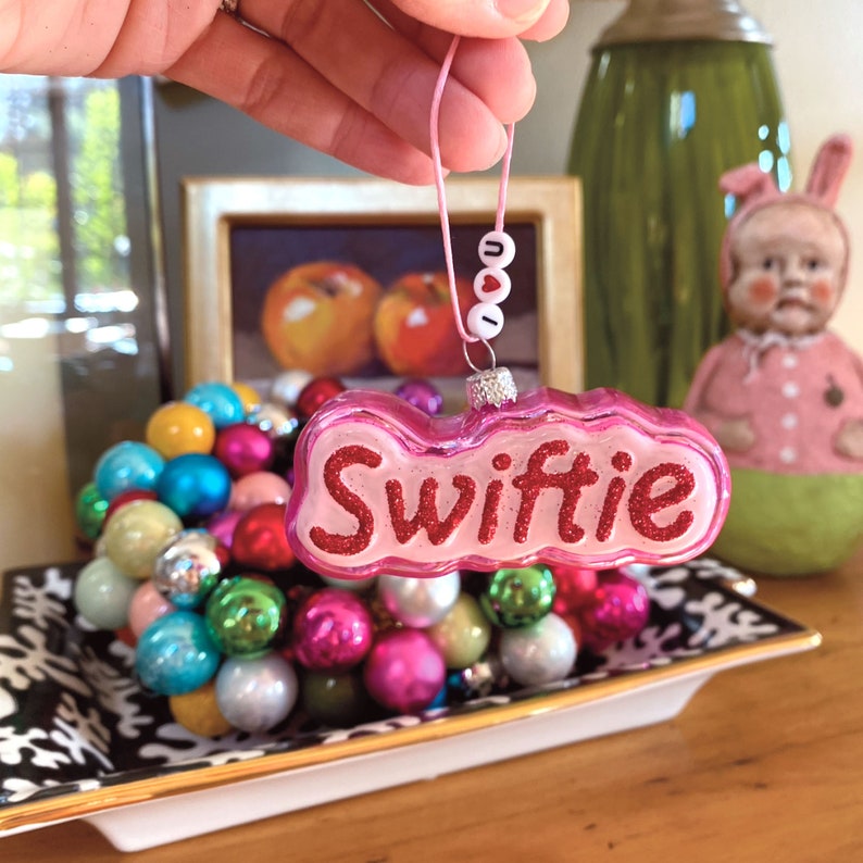 Swiftie Glass Ornament with Friendship Bracelet by Cody Foster