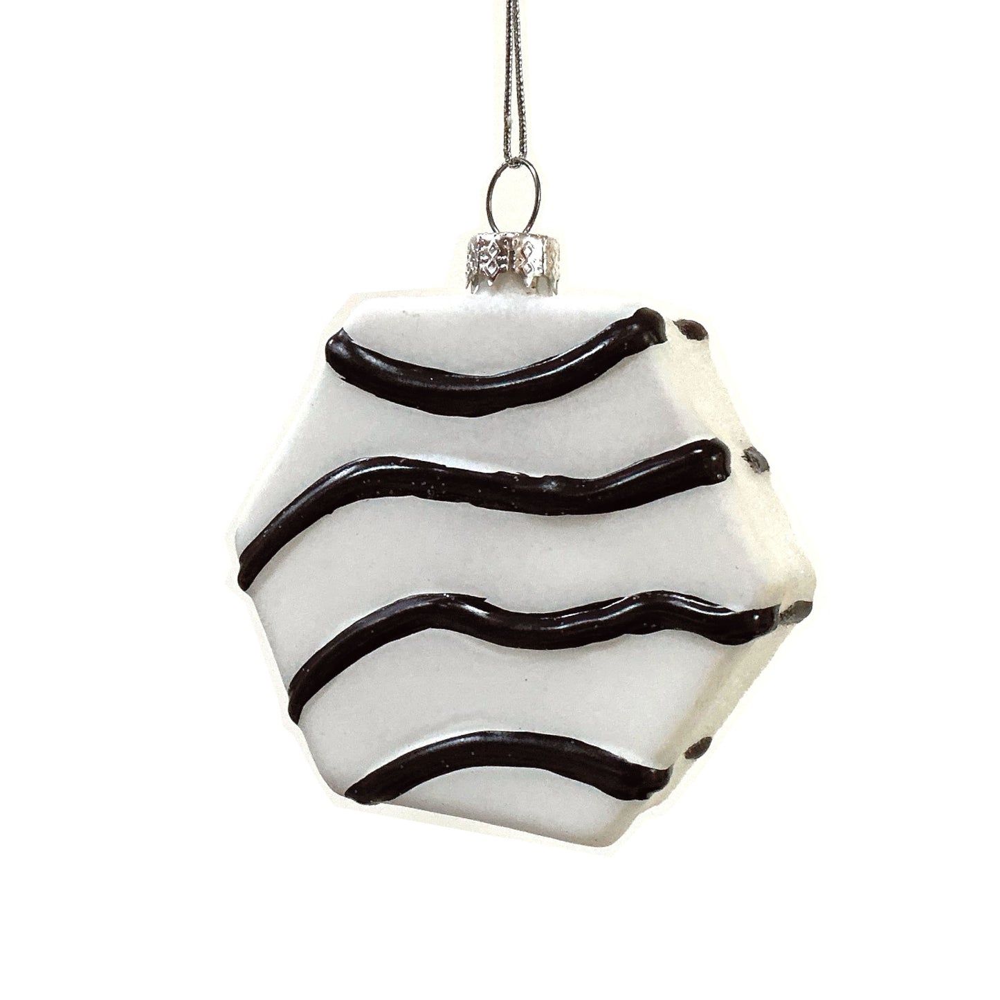 Decorative six-sided ornament with fudge-colored wavy lines on a white background