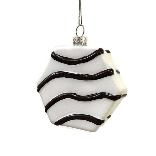 Decorative six-sided ornament with fudge-colored wavy lines on a white background